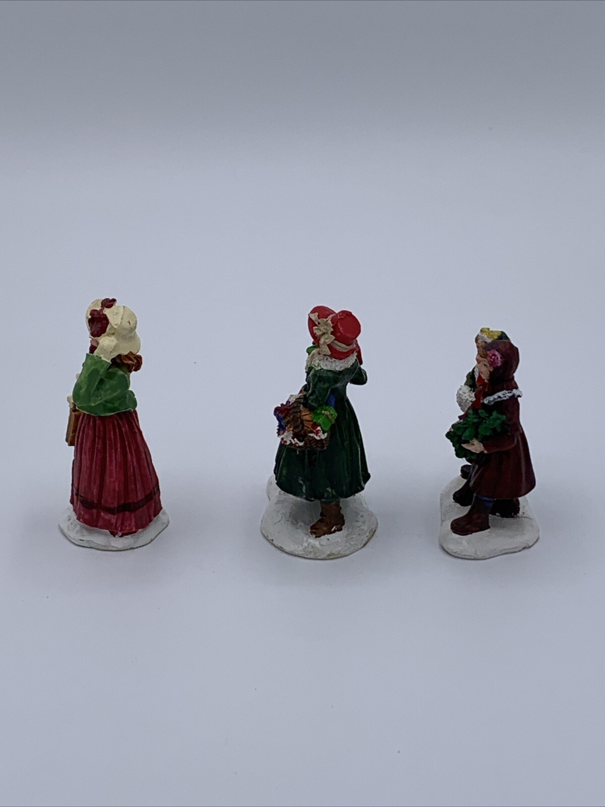 Lot of 3 Unbranded Christmas Village Figurines Tallest is 2.5 inches